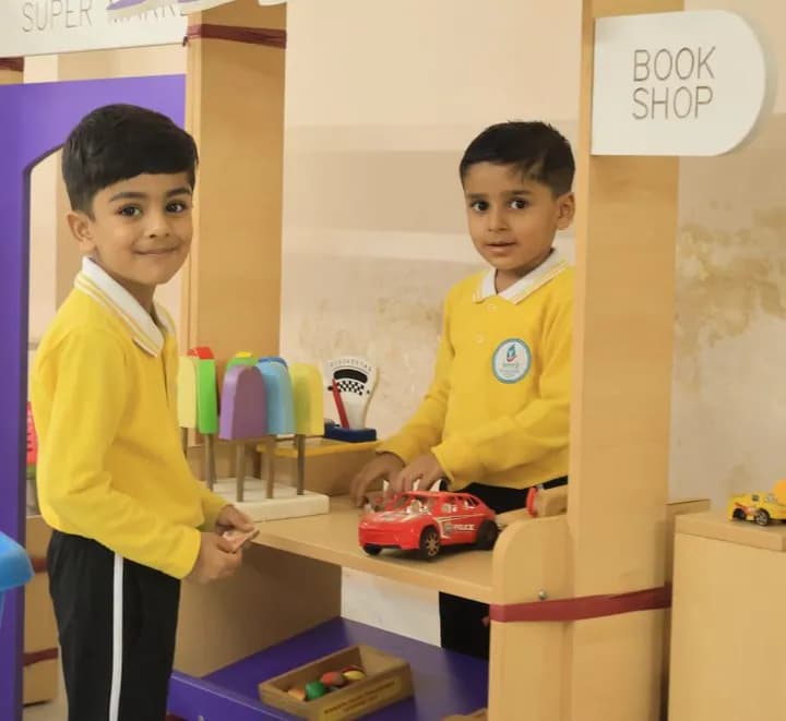 Two children running a pretend bookshop