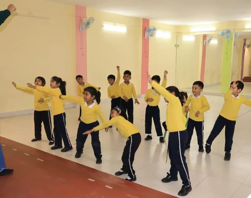 A dance class mid-routine in the activity hall